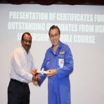 Director Receiving Award from SEMBAWANG Shipyard Managing Director for good safety performance by Cutech Team.