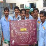 Workers with Safety Affirmatives Sign Board.